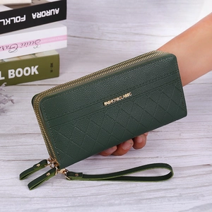 Detail of dark green pebble leather long wallet with double zippers and wrist strap