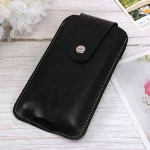 Close-up of slim vertical leather phone holster with metal snap button on wood background