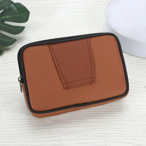Detail view of the rear belt loop design on a brown leather phone holster bag for men