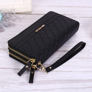 Close-up of black quilted faux leather wallet with double zipper and wrist strap