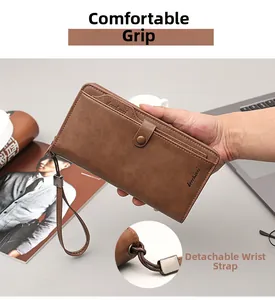 Detail of long brown leather wallet showing detachable wrist strap and comfortable grip