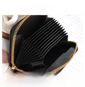 Detail of black stone-pattern card holder featuring nine organ-style accordion slots