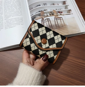 Vintage argyle pattern folding wallet for women with brown leather trim and button closure