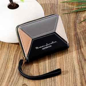 Short women's wallet with patchwork geometric design and secure zipper wristlet