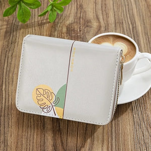 Light grey multi-slot women's short wallet with leaf pattern and gold zipper detail