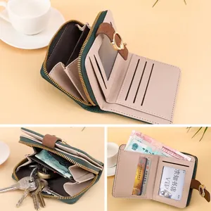 Portefeuille compact en cuir vert foncé avec poche zippée et fermeture par bouton-pression