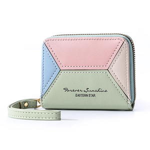 Detail view of colorful patchwork PU leather wallet with zipper closure and wrist strap