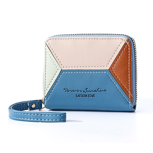 Detail of color-blocked leather wallet with Forever Sunshine text and wrist strap