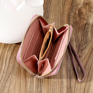 Interior detail of pink multi-slot women wallet showing card slots and zipper pocket