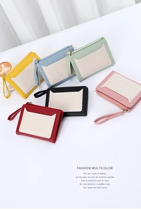 Short women's wallets in six colors with cat-ear trim and secure golden zip closure