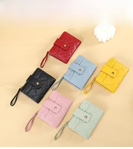 Quilted mini wallets in multiple colors featuring card slots and wrist straps