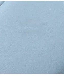 Detailed close-up showing light blue synthetic PU leather texture with lychee grain finish