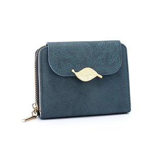 Close-up of deep blue matte wallet featuring a golden leaf clasp and fine leaf textures