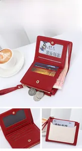 Detailed view of dark red leather wallet featuring multiple card slots and zipper pouch