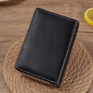 Close-up of black wave line short wallet with white contrast stitching and gold zipper