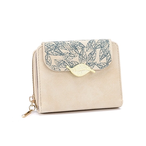 Detail of small beige flap wallet with leaf print and golden leaf-shaped clasp buckle