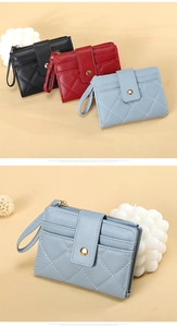 Detail of multi-color quilted leather coin purses with card slots and wristlet straps