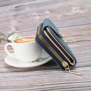Detail view of the multi-slot card holder and golden zipper pocket inside the wallet