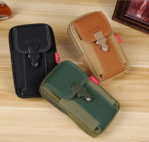 Close-up of tactical nylon phone pouches in black, tan and olive with durable buckles