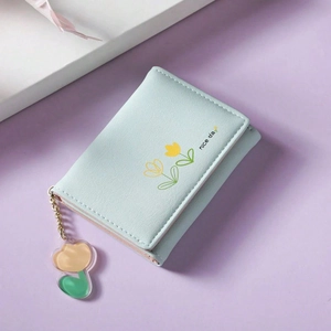 Light blue tri-fold PU leather wallet featuring a nice day print and tulip flower charm
