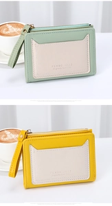 Detailed view of bicolor slim wallets with zipper pockets and lychee grain texture