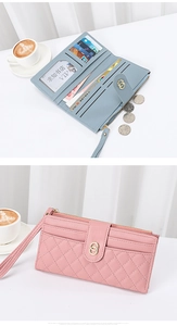 Detail of quilted leather long wallet showing multi-card slots and secure twist lock buckle