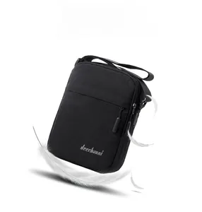 Close-up of lightweight black crossbody bag with feathers highlighting the light weight