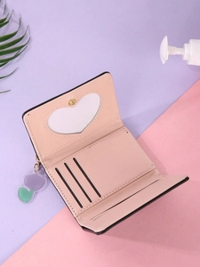 Detail of pink PU leather wallet showing heart photo slot, card slots and double heart charms