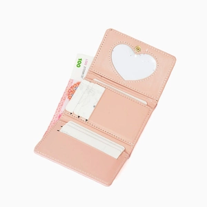 Detail view of pink PU leather tri-fold wallet showing card slots and heart photo window