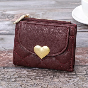 Burgundy quilted heart wallet with gold zipper and heart-shaped metal clasp buckle