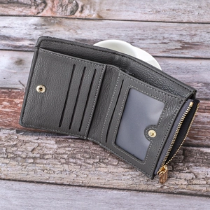 Detailed interior of the dark grey short wallet showing card slots and heart embossed window