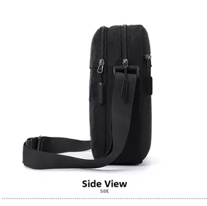 Side view of lightweight black canvas shoulder bag showing three zippered compartments