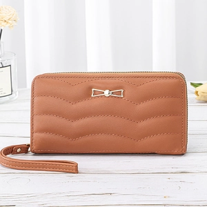 Long brown quilted faux leather wallet for women with wristlet and metal bow detail