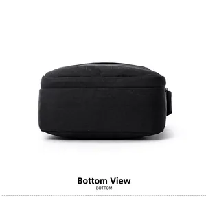 Detail view of the reinforced bottom and sturdy stitching on this black canvas crossbody bag