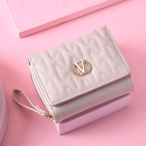Pink quilted PU leather tri-fold short wallet with V-logo and wristlet strap