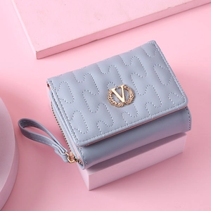 Short tri-fold quilted wallet in light blue with gold V logo and hand strap