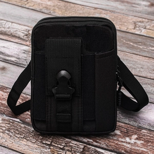 Tactical black nylon waist bag with double zippers and pen holder on wooden background