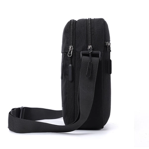 Men's minimalist black crossbody bag with durable nylon material and dual zip compartments