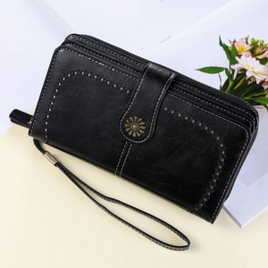 Portefeuille femme RFID noir avec décor floral en métal et dragonne amovible pratique