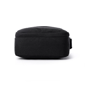Lightweight black canvas shoulder bag for men showing durable fabric and bottom construction