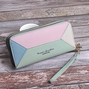 Close-up of color-block patchwork long wallet with dual zippers and wrist strap