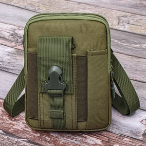 Close-up of army green tactical waist bag with heavy-duty buckle on wooden surface