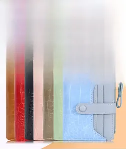 Short stone pattern wallets for women shown in various colors with a side zipper detail