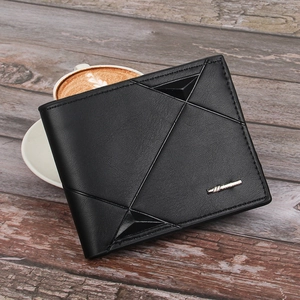 Men's slim bi-fold black leather wallet with geometric stitching on dark wood table