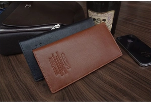 Close-up of litchi texture on men's long leather wallets in black and brown finishes