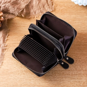Macro view of dual-zipper leather card holder with RFID blocking and accordion slots