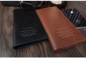 Detailed close-up of premium lychee grain leather wallet with embossed business logo