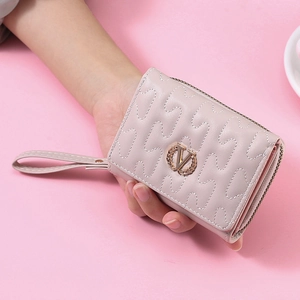 Close-up of pink PU leather trifold wallet with V-shaped logo and quilted wave pattern