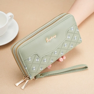 Portefeuille long vert menthe à double zip avec motif gaufré et détails floraux