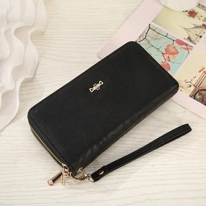 Detail of black floral embossed PU leather wallet with golden butterfly clasp and double zipper